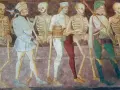 Postać szkieletów i ludzi w średniowiecznych strojach, symbolizująca danse macabre w literaturze.
